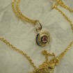 bright-ruby-small-conpact-gold-pendant-70298.jpg
